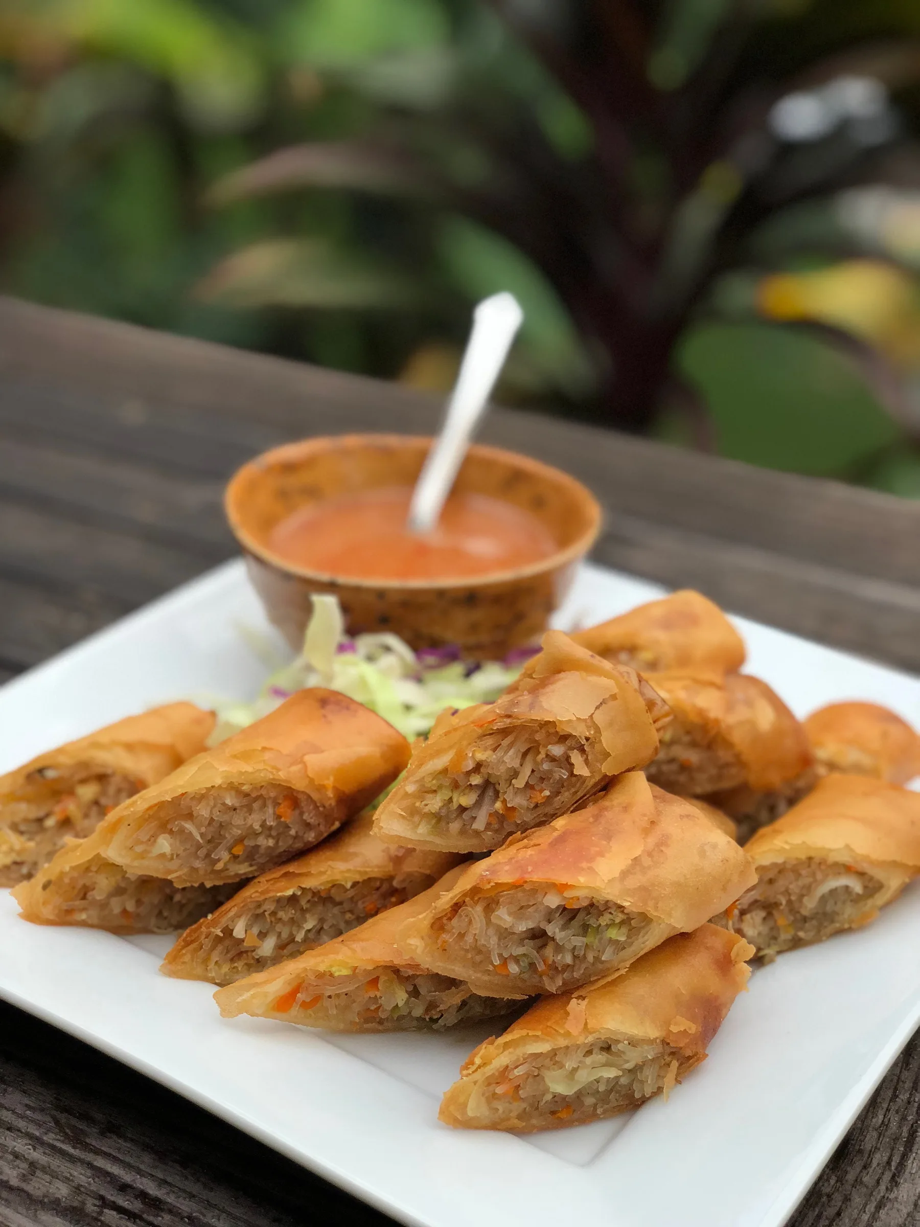 Spring Rolls (Po Piak Tod) with a pot of dipping sauce