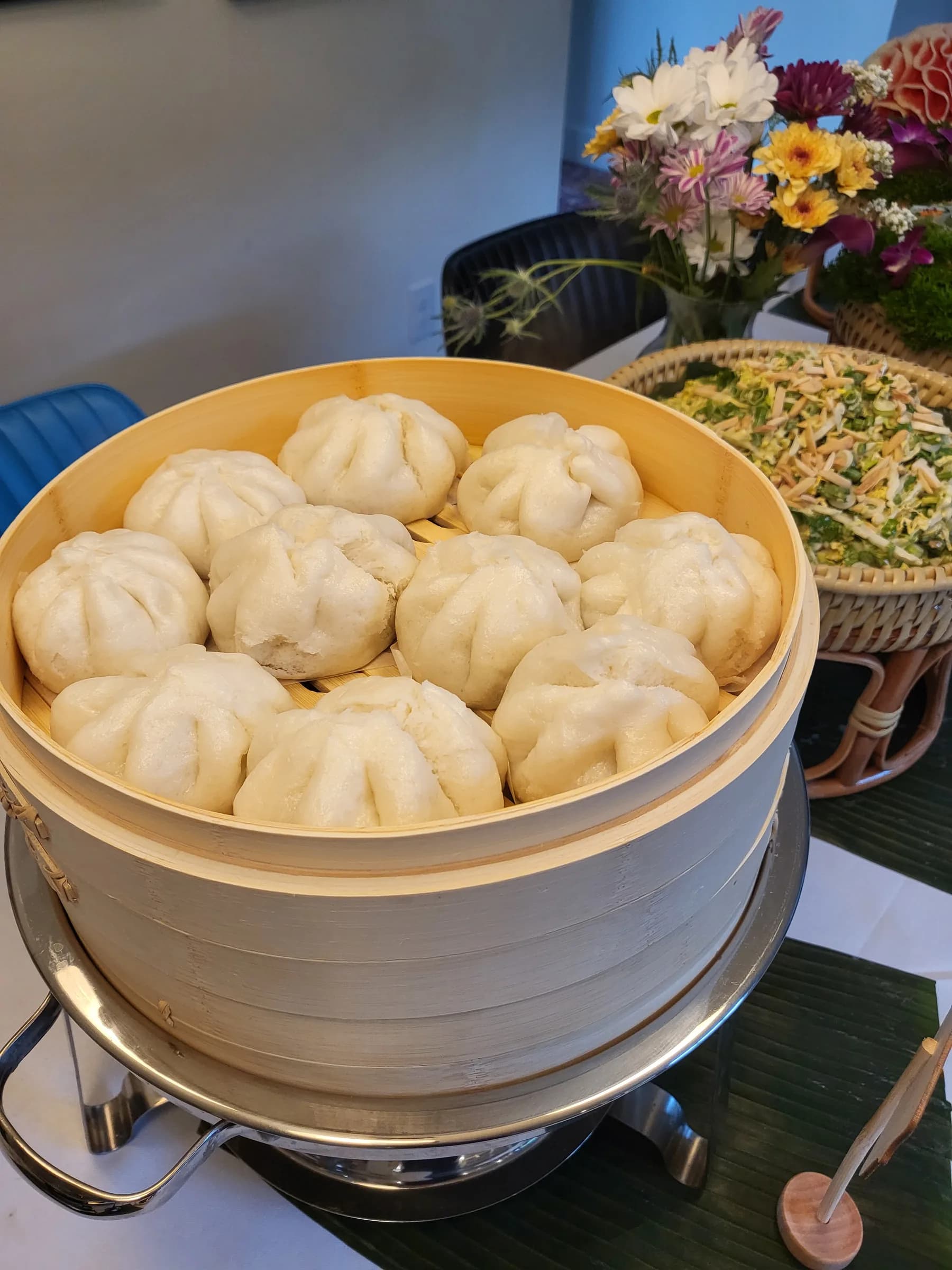 Steamed buns in a bamboo steamer